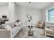 Living room with grey couch, high ceilings, and natural light at 286 Begonia Ln, Kissimmee, FL 34759