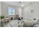 Cozy living room with comfy seating and large windows at 286 Begonia Ln, Kissimmee, FL 34759