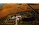 Aerial view of home, pond, and surrounding landscape at 3000 Tohopekaliga Dr, St Cloud, FL 34772