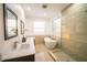 Elegant bathroom with soaking tub and walk-in shower at 3000 Tohopekaliga Dr, St Cloud, FL 34772