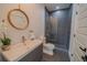 Bathroom with gray tile, a floating vanity and walk-in shower at 3000 Tohopekaliga Dr, St Cloud, FL 34772