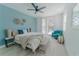 Bright bedroom with a queen-size bed and a sitting area at 3000 Tohopekaliga Dr, St Cloud, FL 34772