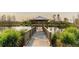 Wooden gazebo with bridge over calm water at 3000 Tohopekaliga Dr, St Cloud, FL 34772