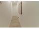 Bright hallway with light wood floors and decorative wall art at 3000 Tohopekaliga Dr, St Cloud, FL 34772