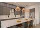 Modern kitchen island with white countertops and wooden stools at 3000 Tohopekaliga Dr, St Cloud, FL 34772