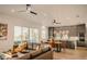 Open floor plan with a modern kitchen and comfortable living area at 3000 Tohopekaliga Dr, St Cloud, FL 34772