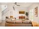 Spacious living area with sectional sofa, large TV, and modern decor at 3000 Tohopekaliga Dr, St Cloud, FL 34772