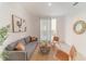 Living room with gray sofa and sliding glass doors at 3000 Tohopekaliga Dr, St Cloud, FL 34772
