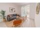 Living room with gray sofa and sliding glass doors at 3000 Tohopekaliga Dr, St Cloud, FL 34772