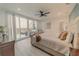 Main bedroom with large bed and access to balcony at 3000 Tohopekaliga Dr, St Cloud, FL 34772