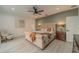 Spacious main bedroom with a large bed and ceiling fan at 3000 Tohopekaliga Dr, St Cloud, FL 34772