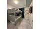Cozy bedroom features gray bunk beds, neutral walls, and tiled floors at 3180 Paradox Cir # 102, Kissimmee, FL 34746