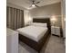 Bedroom with a king size bed, a ceiling fan, and tile flooring at 3180 Paradox Cir # 102, Kissimmee, FL 34746