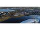 Wide aerial shot of the community, highlighting the lake, waterpark, and the surrounding residential area at 3180 Paradox Cir # 102, Kissimmee, FL 34746