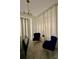 Dining room with two blue chairs, two grey chairs, and light filtering curtains at 3180 Paradox Cir # 102, Kissimmee, FL 34746