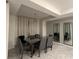 Dining room featuring geometric wallpaper, mirrors, and a modern chandelier at 3180 Paradox Cir # 102, Kissimmee, FL 34746