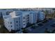 Apartment building with modern design, multiple floors, and ample parking at 3180 Paradox Cir # 102, Kissimmee, FL 34746