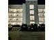 Apartment building exterior featuring multiple floors with balconies and ample parking at 3180 Paradox Cir # 102, Kissimmee, FL 34746