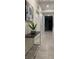 Hallway decorated with a decorative table, plant, and picture at 3180 Paradox Cir # 102, Kissimmee, FL 34746