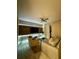 Modern living room with a flat screen TV, fan, and light-up wall at 3180 Paradox Cir # 102, Kissimmee, FL 34746