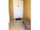 Inviting condo entry with a white door and a bench at 3719 Conroy Rd # 2023, Orlando, FL 32839