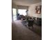 Comfortable living room featuring a sofa and armchairs at 3719 Conroy Rd # 2023, Orlando, FL 32839