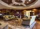 Luxurious lobby with wood paneling, comfortable sofas, and an elegant rug at 3719 Conroy Rd # 2023, Orlando, FL 32839