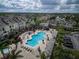 Inviting community pool with surrounding lounge chairs and landscaping at 3719 Conroy Rd # 2023, Orlando, FL 32839