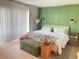Bright bedroom featuring a king-size bed and access to a patio at 4149 S Semoran Blvd # 10, Orlando, FL 32822