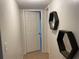 Clean hallway with tile flooring and modern wall decor at 4149 S Semoran Blvd # 10, Orlando, FL 32822