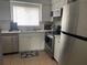 Modern kitchen with stainless steel appliances and white cabinets at 4149 S Semoran Blvd # 10, Orlando, FL 32822