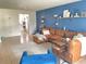 Living room with sectional sofa and view of kitchen at 4149 S Semoran Blvd # 10, Orlando, FL 32822