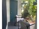 Private patio with two modern chairs and a storage unit at 4149 S Semoran Blvd # 10, Orlando, FL 32822