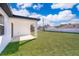 Covered patio and fenced-in grassy backyard at 4690 Sw 139Th Place, Ocala, FL 34473