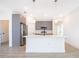 Modern kitchen with gray cabinets and a large island at 4690 Sw 139Th Place, Ocala, FL 34473