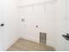 Laundry room with wire shelving and tile floor at 4690 Sw 139Th Place, Ocala, FL 34473