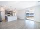 Open living area with kitchen, sliding doors, and tile floor at 4690 Sw 139Th Place, Ocala, FL 34473
