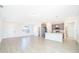 Open living area with kitchen and sliding glass doors at 4690 Sw 139Th Place, Ocala, FL 34473