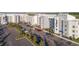 Aerial view of apartment building with parking and surrounding landscape at 4731 Clock Tower Dr # 206, Kissimmee, FL 34746