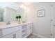 Modern bathroom with double vanity and walk-in shower at 4731 Clock Tower Dr # 206, Kissimmee, FL 34746