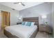Spacious Primary bedroom with large bed and ensuite bathroom access at 4731 Clock Tower Dr # 206, Kissimmee, FL 34746