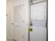 Convenient laundry room with stackable washer and dryer at 4731 Clock Tower Dr # 206, Kissimmee, FL 34746