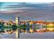 Reflective lake and community at sunrise at 554 Heartwell Dr, Kissimmee, FL 34759