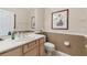 Guest bathroom with single sink vanity and toilet at 554 Heartwell Dr, Kissimmee, FL 34759