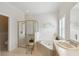 Bathroom features a shower, tub, and double vanity at 554 Heartwell Dr, Kissimmee, FL 34759