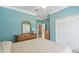 Bright bedroom with a dresser and double closet at 554 Heartwell Dr, Kissimmee, FL 34759