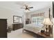 Spacious bedroom with a dresser and queen-size bed at 554 Heartwell Dr, Kissimmee, FL 34759