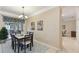 Spacious dining area with table and chairs, near kitchen at 554 Heartwell Dr, Kissimmee, FL 34759