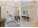 Bright and airy entryway with tile floors and elegant furniture at 554 Heartwell Dr, Kissimmee, FL 34759
