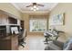 Bright home office with built-in desk and shelving unit at 554 Heartwell Dr, Kissimmee, FL 34759